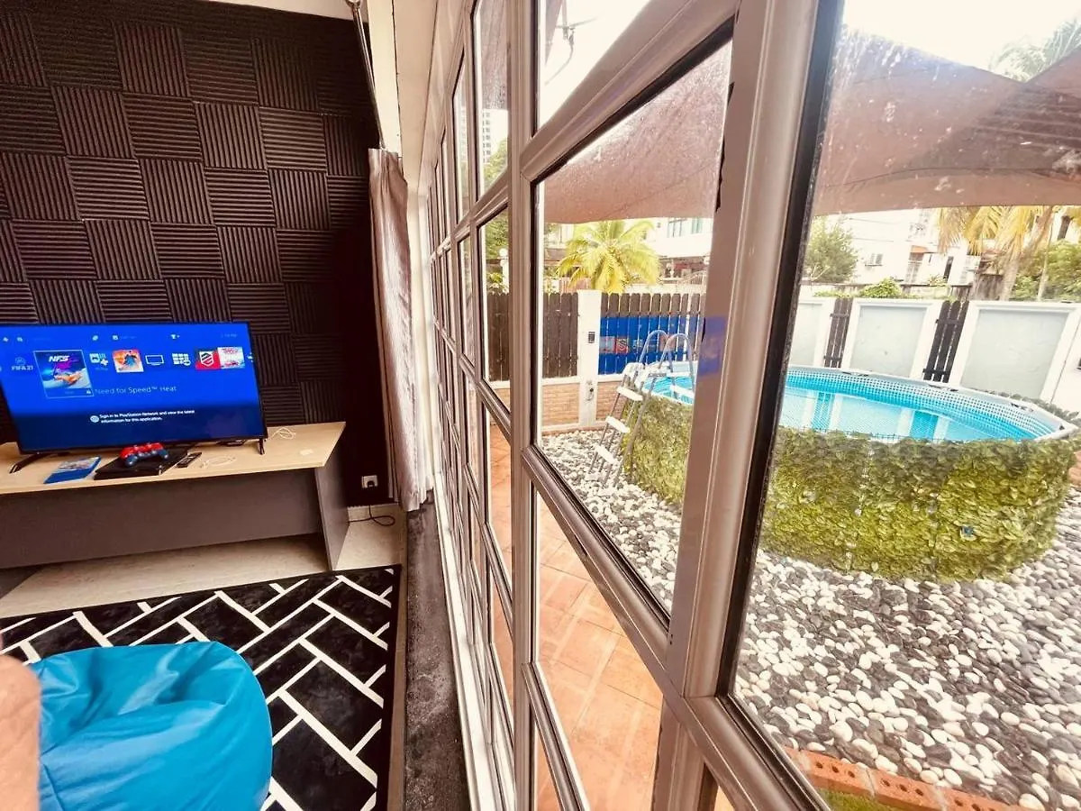 Trendy Family Getaway by Stayco: Beachside Oasis with Mini-Pool & Entertainment Batu Ferringhi